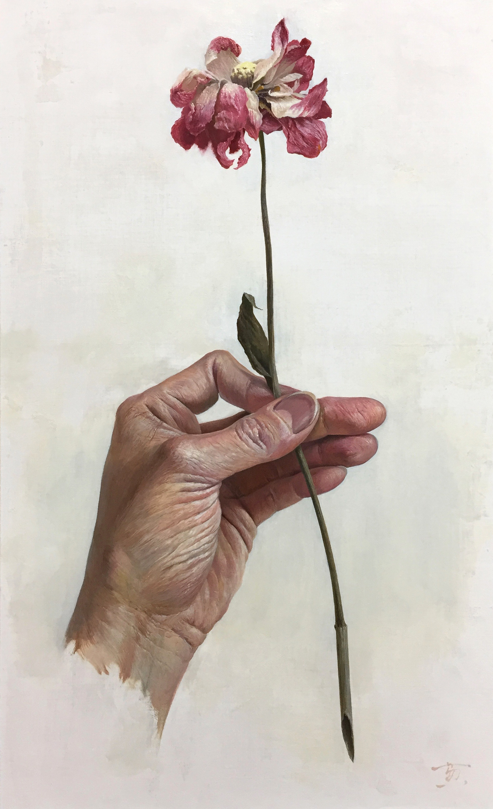 手と花